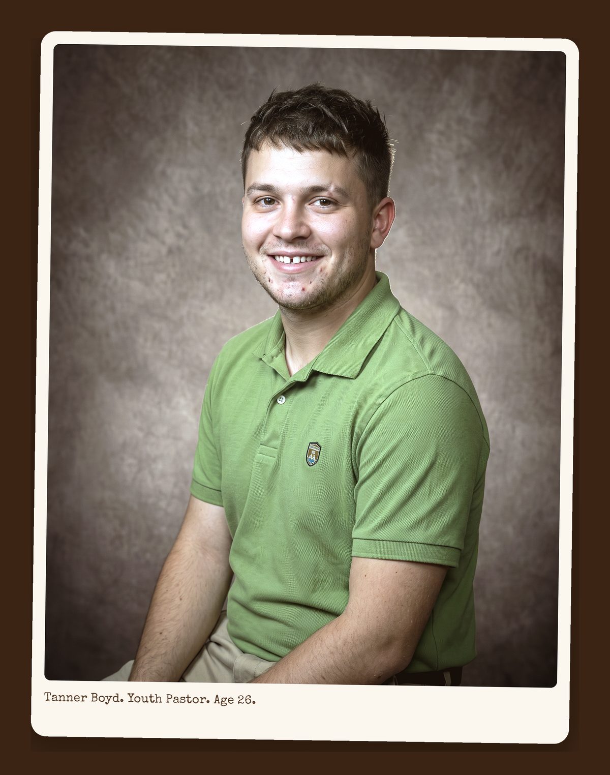 Tanner Boyd, mid-twenties, green polo shirt, smiling, directory portrait.
